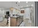 Stylish kitchen island with seating, pendant lighting, and modern sink fixtures at 25062 E Cedar Pl, Aurora, CO 80018