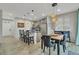 Contemporary kitchen featuring a large island with bar seating, pendant lighting, and modern appliances at 25062 E Cedar Pl, Aurora, CO 80018