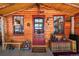 Cozy cabin entrance with rustic wooden decor and charming details at 27802 Shadow Mountain Dr, Conifer, CO 80433