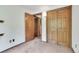 Standard bedroom featuring double door closets and entryway at 4843 Silver Spruce Ln, Evergreen, CO 80439