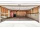 Spacious garage with ample storage potential, exposed wall studs, and easy access to the home at 4843 Silver Spruce Ln, Evergreen, CO 80439