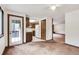 Open concept living room seamlessly connects to the kitchen, enhancing the home's spacious feel at 4843 Silver Spruce Ln, Evergreen, CO 80439