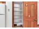 The kitchen boasts a pantry with multiple shelves, ideal for organized storage at 4843 Silver Spruce Ln, Evergreen, CO 80439
