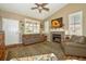 Living room with a gas fireplace and hardwood floors at 1288 Paula Cir, Monument, CO 80132