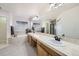 Bright primary bathroom with dual sinks, a soaking tub, and a walk-in shower at 1525 E 133Rd Ave, Thornton, CO 80241