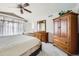 Bedroom featuring neutral carpet, wood furnishings, and window with curtains at 1525 E 133Rd Ave, Thornton, CO 80241