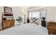 Cozy living room with large window and neutral carpet, ideal for relaxation at 1525 E 133Rd Ave, Thornton, CO 80241