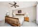 Vaulted main bedroom with ceiling fan, neutral carpet, and lamps at 1525 E 133Rd Ave, Thornton, CO 80241