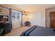 Comfortable bedroom with a large window, closet space, and a calming atmosphere at 26 Wedge Way, Littleton, CO 80123