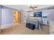 Spacious bedroom with a university banner, personal decor, and access to ensuite bathroom at 26 Wedge Way, Littleton, CO 80123