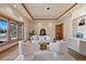 Inviting living room featuring an oversized window, tray ceiling, and neutral decor at 26 Wedge Way, Littleton, CO 80123