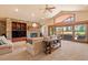 Bright and inviting living room with a fireplace, vaulted ceilings, and natural light from sliding glass doors at 26 Wedge Way, Littleton, CO 80123