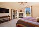 Spacious main bedroom features a fireplace, outside access, and large windows for natural light at 26 Wedge Way, Littleton, CO 80123