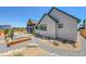 Beautiful backyard landscaping with decorative gravel, rocks, and raised garden beds at 1148 Hillside Ln, Louisville, CO 80027