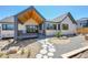 Beautiful backyard with modern landscaping, including decorative rocks and stepping stones at 1148 Hillside Ln, Louisville, CO 80027