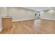 Spacious finished basement area with modern wood flooring and wet bar at 1148 Hillside Ln, Louisville, CO 80027