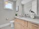 Modern bathroom with stylish vanity, elegant faucet, and well-placed decor and plants at 1148 Hillside Ln, Louisville, CO 80027
