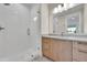 This lovely bathroom features white tile shower, modern fixtures, and a spacious vanity at 1148 Hillside Ln, Louisville, CO 80027