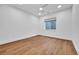 Bright bedroom with a ceiling fan, recessed lighting, and a large window at 1148 Hillside Ln, Louisville, CO 80027