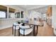 Open-concept dining area showing modern decor and view of kitchen at 1148 Hillside Ln, Louisville, CO 80027