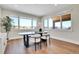 Bright dining area with modern table and chairs with views of the outdoors at 1148 Hillside Ln, Louisville, CO 80027