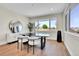 Dining area with modern furnishings and large windows offering natural light at 1148 Hillside Ln, Louisville, CO 80027