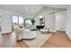 Bright and airy living room with sliding glass doors, hardwood floors and contemporary decor at 1148 Hillside Ln, Louisville, CO 80027