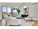Living room with sliding glass doors, modern decor, and an open floor plan that enhances spaciousness at 1148 Hillside Ln, Louisville, CO 80027
