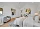 Airy main bedroom featuring modern design, hardwood floors, a sitting area and neutral colors at 1148 Hillside Ln, Louisville, CO 80027
