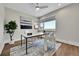 Bright office features a large window, stylish decor, and sleek hardwood flooring at 1148 Hillside Ln, Louisville, CO 80027