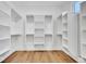 Bright walk-in closet with built-in shelving and racks offers ample storage space at 1148 Hillside Ln, Louisville, CO 80027