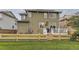 Spacious backyard with a wooden fence and a deck, perfect for outdoor activities and relaxation at 3120 Redhaven Way, Highlands Ranch, CO 80126