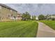 Lush backyard with a walking path and wooden fences, offering a serene outdoor space at 3120 Redhaven Way, Highlands Ranch, CO 80126