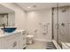 Bright bathroom featuring modern vanity, blue glass vessel sink, and glass-enclosed shower at 3120 Redhaven Way, Highlands Ranch, CO 80126