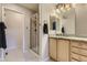 Bathroom featuring a glass-enclosed shower, granite-topped vanity, framed mirrors, and tile flooring at 3120 Redhaven Way, Highlands Ranch, CO 80126
