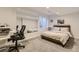 Bright basement bedroom area with carpet, large mirror, and a desk area at 3120 Redhaven Way, Highlands Ranch, CO 80126