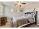Cozy bedroom featuring soft gray walls and a large bed with a decorative headboard at 3120 Redhaven Way, Highlands Ranch, CO 80126