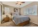Bedroom with neutral walls, carpet, a wood bed frame, and bright natural light at 3120 Redhaven Way, Highlands Ranch, CO 80126