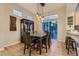 Dining area featuring modern lighting, a table with chairs, and sliding glass doors to the outside at 3120 Redhaven Way, Highlands Ranch, CO 80126