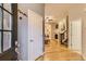 Inviting foyer with hardwood floors, leading to a cozy living room with a fireplace at 3120 Redhaven Way, Highlands Ranch, CO 80126