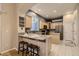Well-appointed kitchen with granite countertops, stainless steel appliances, and breakfast bar at 3120 Redhaven Way, Highlands Ranch, CO 80126