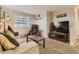 Comfortable living room with plush sofa, massage chair, and large screen television at 3120 Redhaven Way, Highlands Ranch, CO 80126