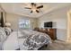 Comfortable main bedroom suite with a tray ceiling, soft lighting, and plush carpet at 3120 Redhaven Way, Highlands Ranch, CO 80126