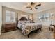 Comfortable main bedroom suite with a four-poster bed, soft lighting, and plush carpet at 3120 Redhaven Way, Highlands Ranch, CO 80126