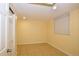 Basement room features a door, window, and tile floor, providing a bright, flexible space at 2211 Quebec St, Denver, CO 80207