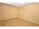Finished basement featuring tiled floors, neutral yellow walls, and recessed lighting at 2211 Quebec St, Denver, CO 80207