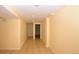 Spacious basement area featuring neutral color scheme and tile flooring, ready to be customized at 2211 Quebec St, Denver, CO 80207
