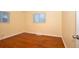 Bedroom with natural light and gleaming hardwood floors at 2211 Quebec St, Denver, CO 80207