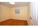 Bedroom with natural light and gleaming hardwood floors at 2211 Quebec St, Denver, CO 80207