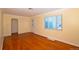 Bright living room features hardwood floors and a doorway at 2211 Quebec St, Denver, CO 80207